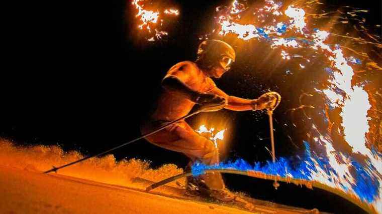 IN IMAGES – Skier Julien Lizeroux descends between burning poles