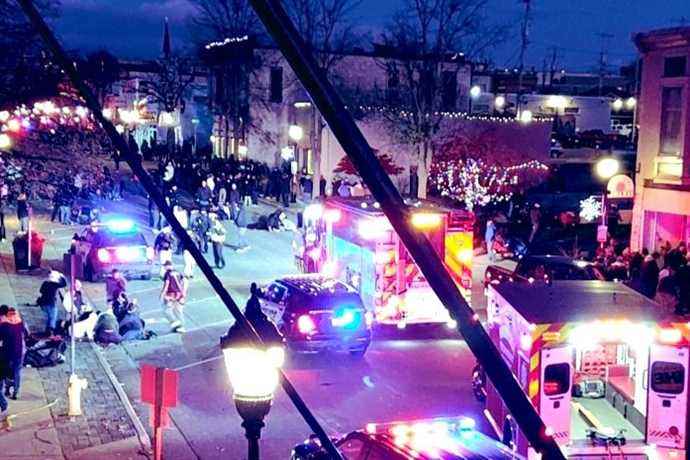 Wisconsin |  A driver rushes through a crowd during a Christmas parade