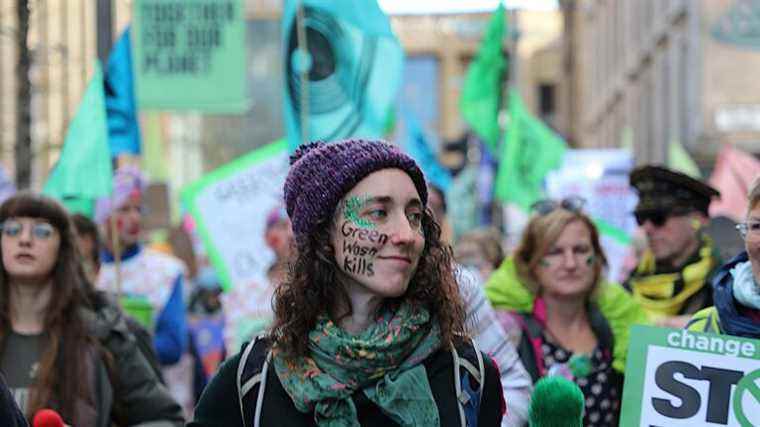 in Glasgow, several hundred people demonstrate against “greenwashing”