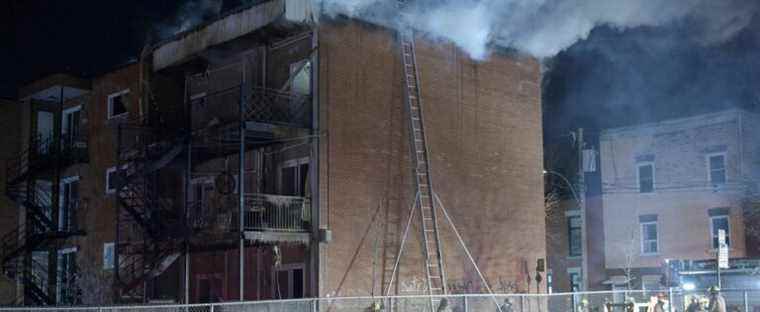 A residential building heavily damaged by fire