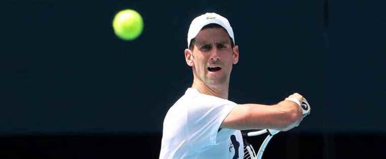 Djokovic trains at Australian Open, participation still pending