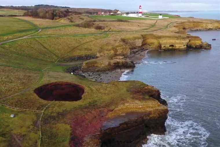 England |  Huge hole reveals hidden underground beach