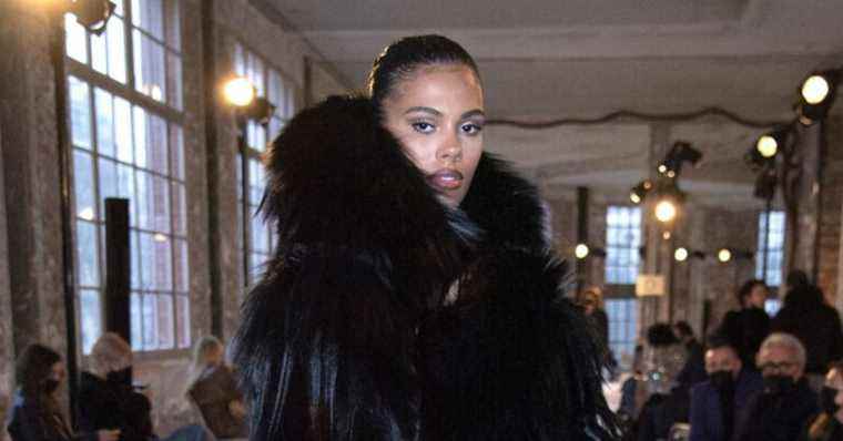 Tina Kunakey is yeti chic: bundled up, she braves the cold for Paris Fashion Week