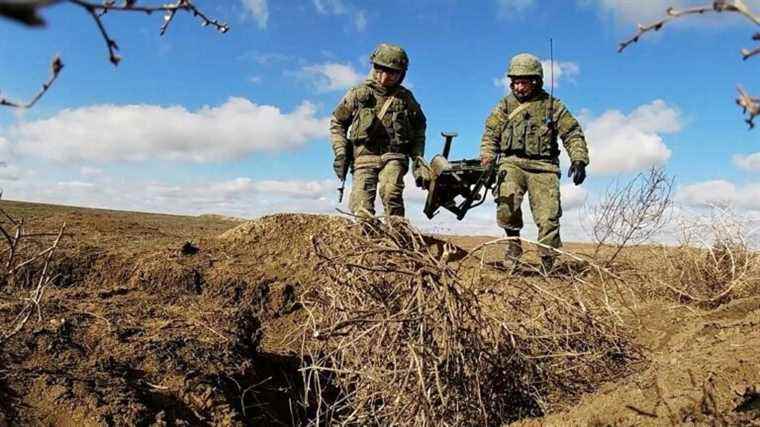 Russian forces deployed near border return to garrisons in first sign of Moscow retreat