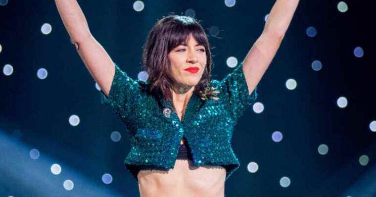 Nolwenn Leroy in a sparkling crop top facing Brigitte Macron, graceful in electric colors