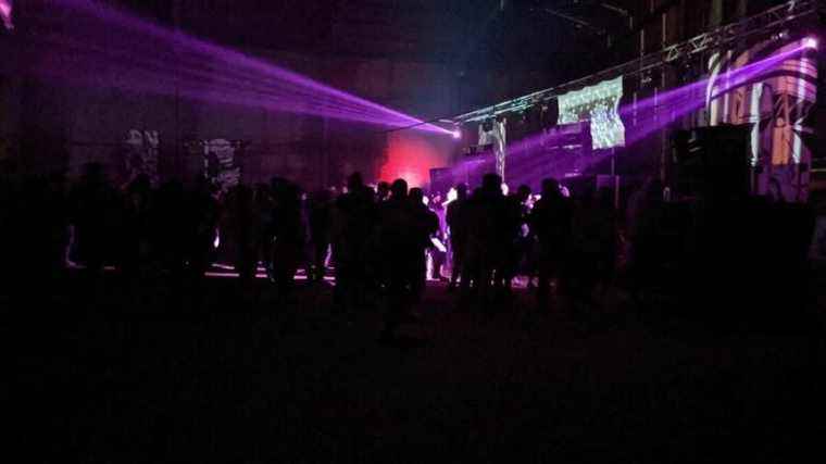 a rave party in an abandoned warehouse, more than 2,000 participants