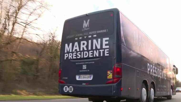 buses bearing the effigy of Marine Le Pen criss-cross France