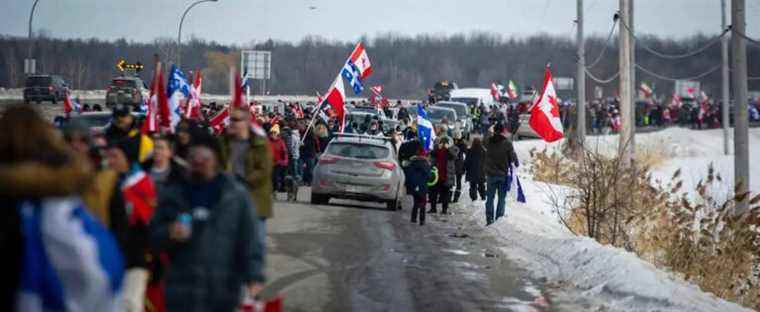 Protesters form a human chain near Highway 40