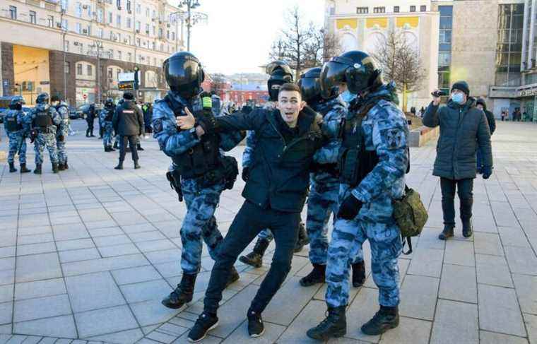 Watched very closely, the Russian demonstrators stand up