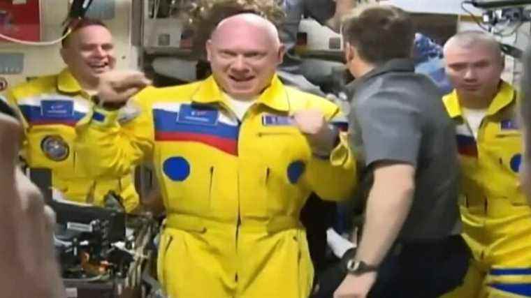 dressed in yellow and blue, Russian cosmonauts are talking about them