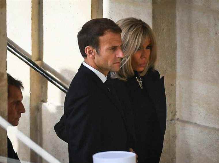 his very reluctant wife Brigitte Macron for an obvious reason