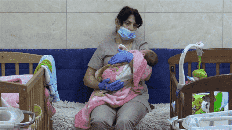 in a bunker in kyiv, nurses watch over babies born from surrogacy