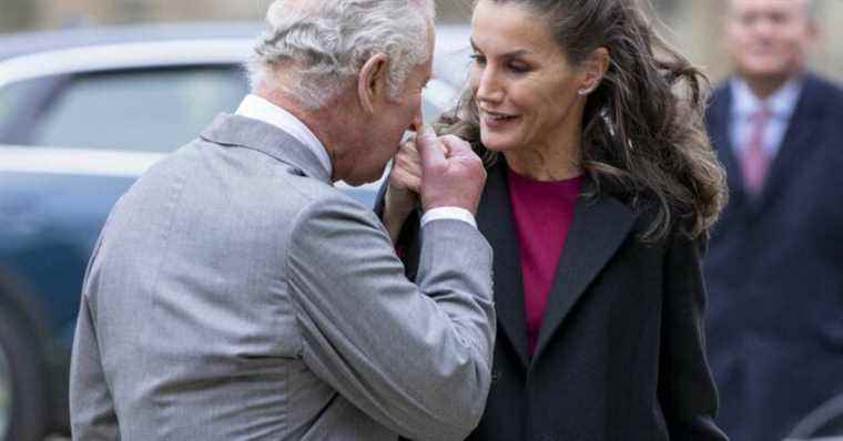 Prince Charles kisses the hand of Queen Letizia of Spain, away from Camilla Parker-Bowles