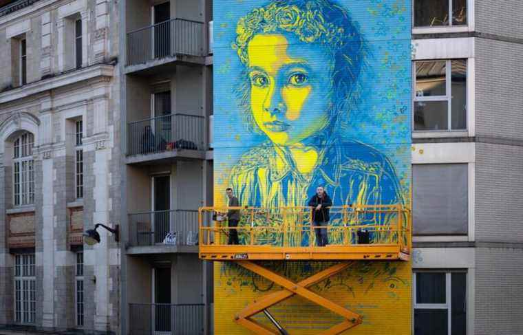 Street artist C215 paints ‘smiles and humanity’ on walls in Ukraine