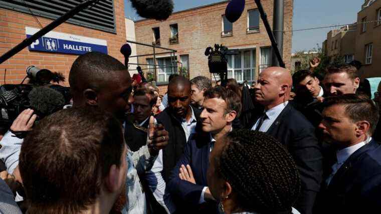 a trader throws cherry tomatoes at the crowd during the presidential visit