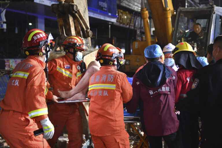 China |  Two people extracted alive Sunday from a collapsed building