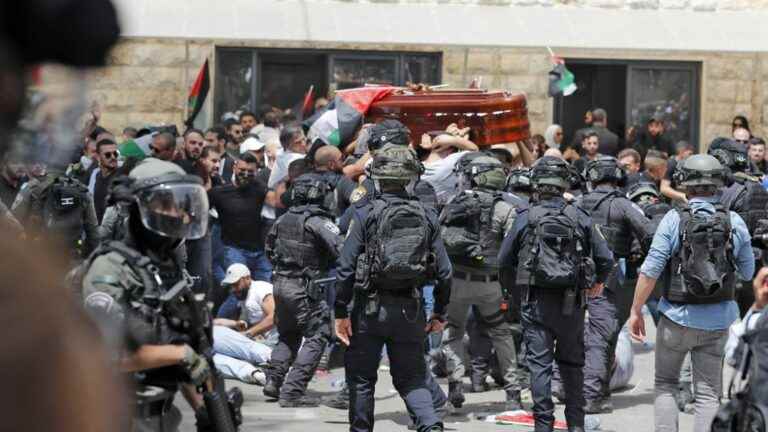 Israeli police charge the crowd at the funeral of Palestinian journalist Shireen Abu Akleh