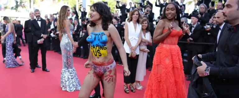 [PHOTOS] Woman denounces Russian rapes in Ukraine on Cannes red carpet