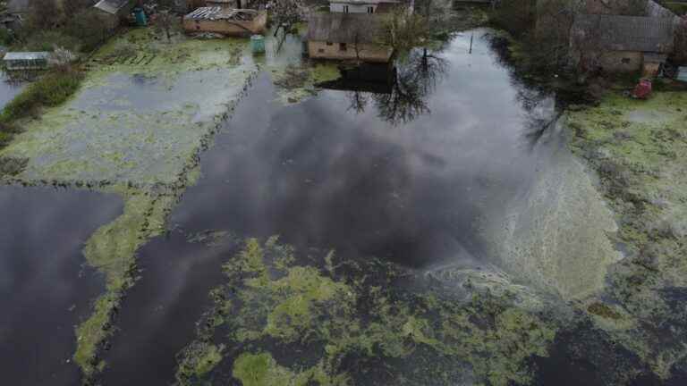 the Ukrainian village of Demydiv under water to halt the advance of the Russians