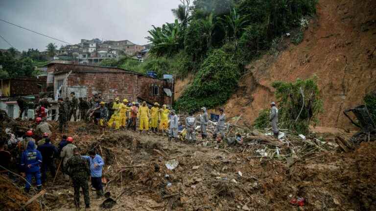 torrential rains left at least 100 dead and 14 missing