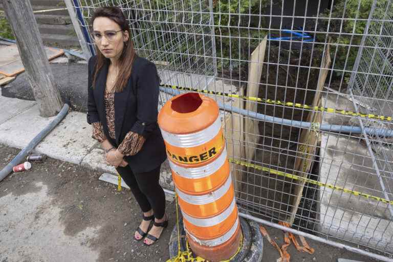 A pedestrian falls into a hole at a construction site