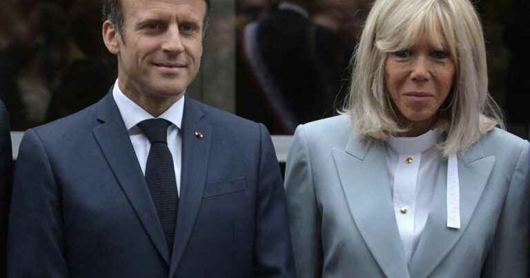 Very chic Brigitte Macron in a pearl gray suit to vote with Emmanuel in the rain!