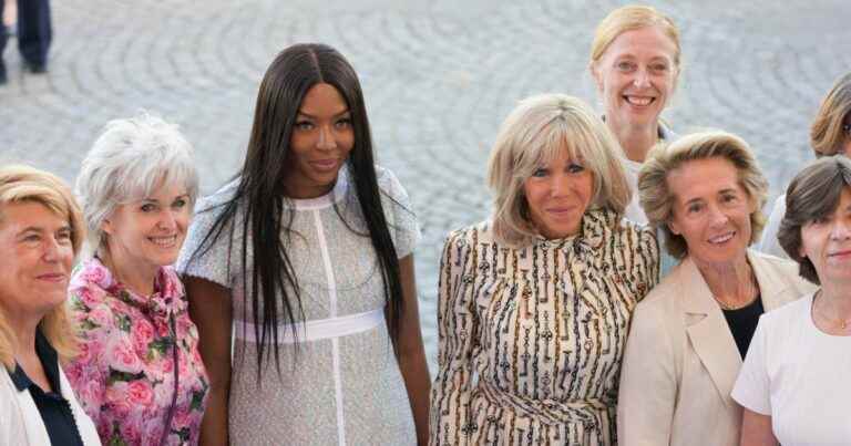 Brigitte Macron chic in Louis Vuitton, competes in elegance with Naomi Campbell at the parade of July 14