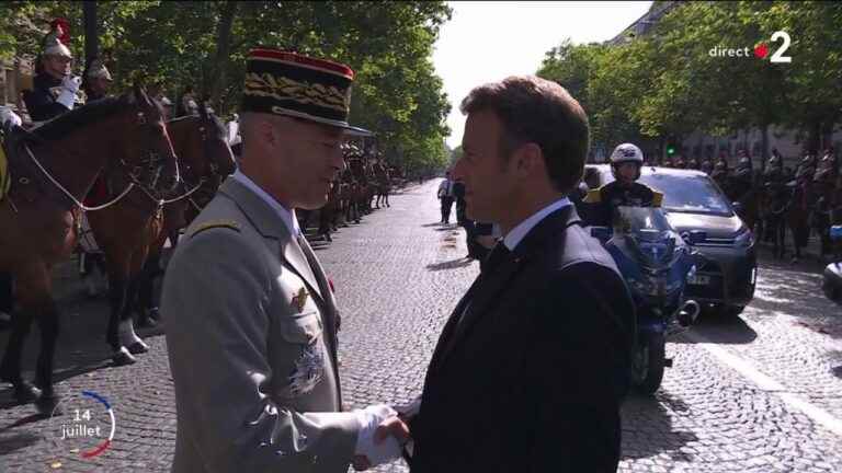 Emmanuel Macron reviews the troops on the avenue des Champs-Elysées