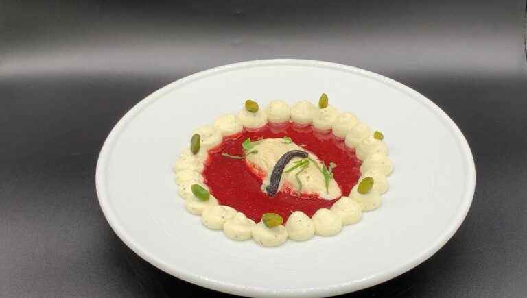 Red fruit soup and vanilla ice cream quenelle