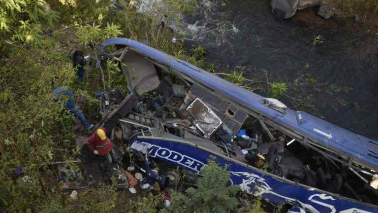 a passenger coach falls from a bridge, more than thirty dead