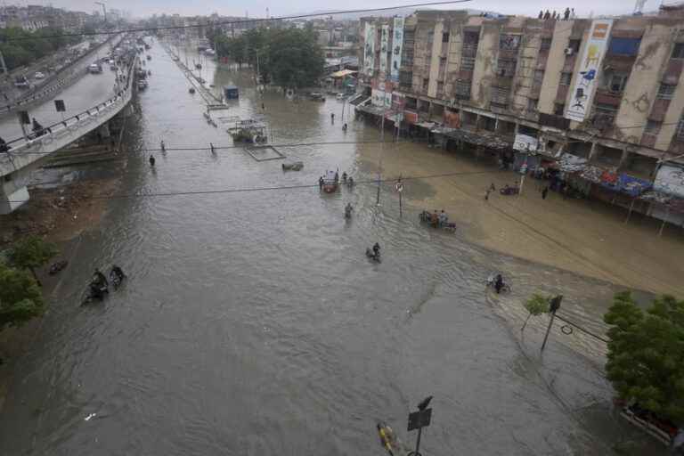 pakistan |  Residents clear debris after floods that killed at least 100 people