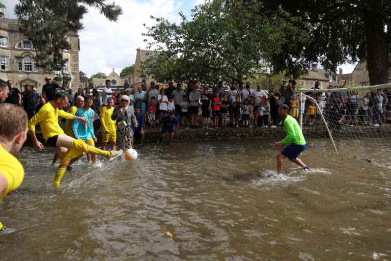 A soccer match in a river in England