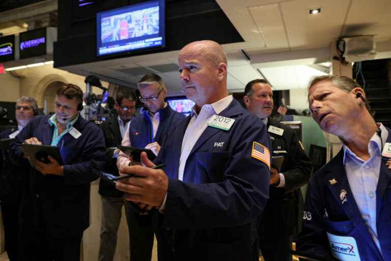 Cautious, Wall Street ends slightly lower