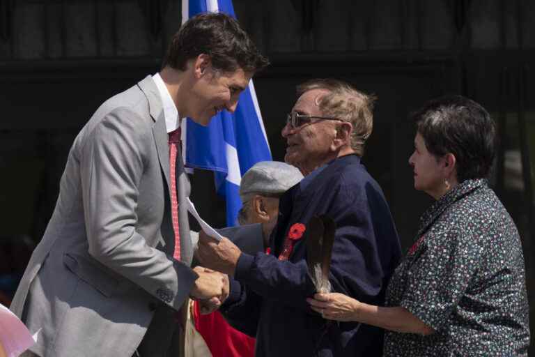 The flag of residential school survivors raised on Parliament Hill