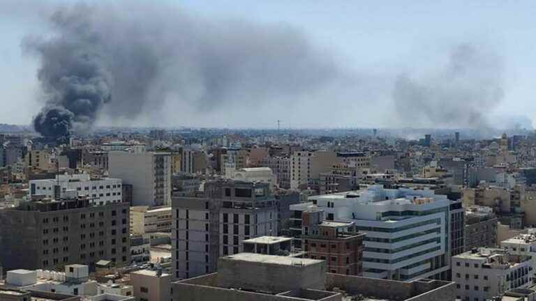 at least 13 people dead in fighting between militias in Tripoli