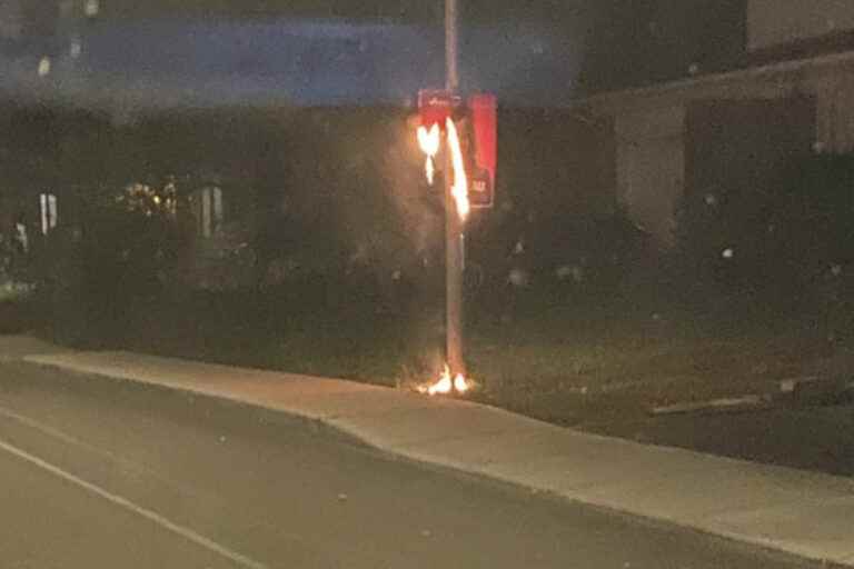 Election sign on fire in Dollard-Des-Ormeaux