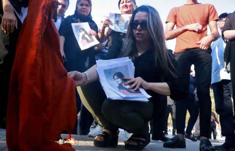 Iranian women burn their veils after the death of Mahsa Amini