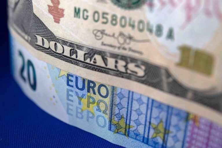 The US dollar just below parity with the euro