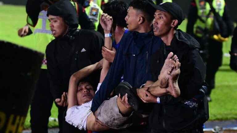 at least 129 dead after crowd movement at football match