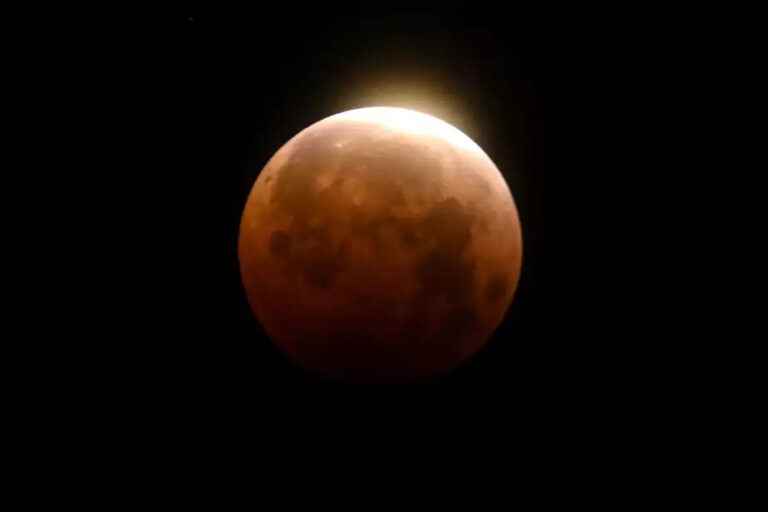 A total lunar eclipse just before dawn on Tuesday