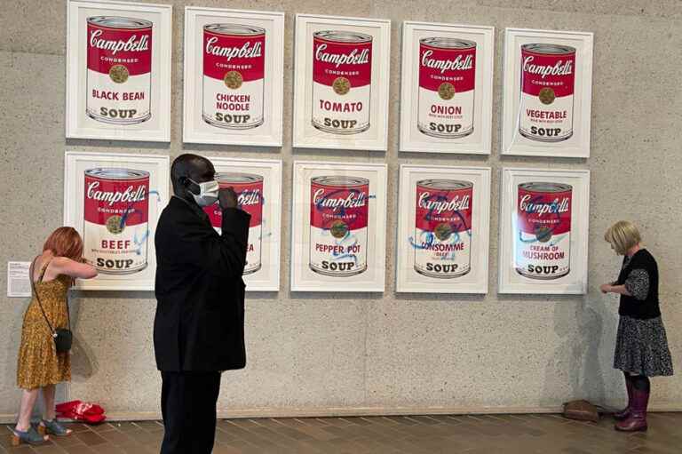 Australia |  Environmental activists cling to an Andy Warhol canvas