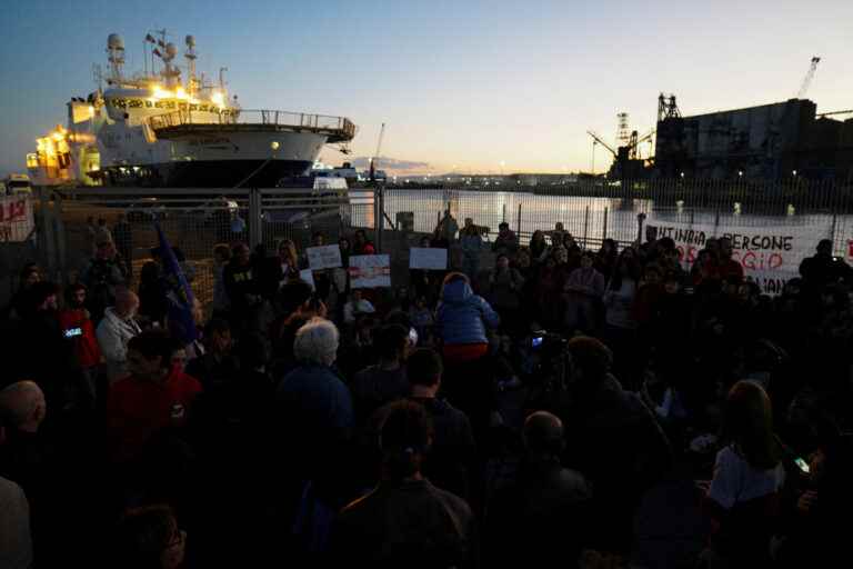 In Sicily, migrants jump into the water