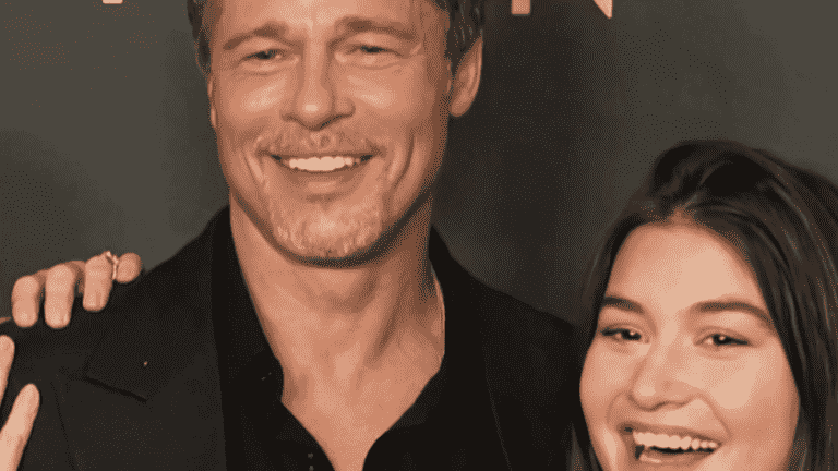 a young woman from Aisne on a red carpet with Brad Pitt