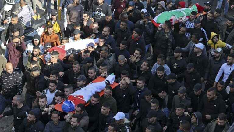 in Jenin, Palestinians bury their dead after an Israeli army raid