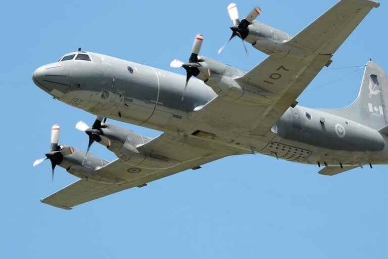 A Canadian military plane flies over Haiti