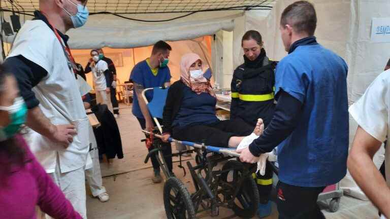 French volunteers set up a field hospital near a devastated town