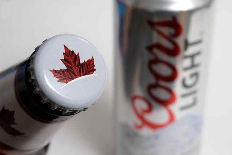 Molson Coors sees sales climb, but posts a loss