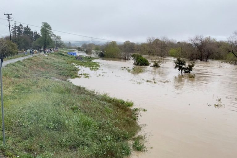 California storm kills two, levee breaks