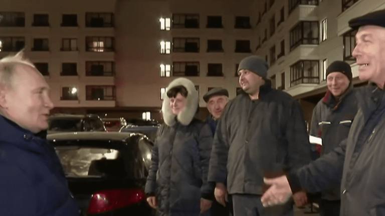 Vladimir Putin appears in Mariupol at night