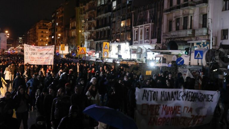 protesters observe a minute’s silence in front of Parliament